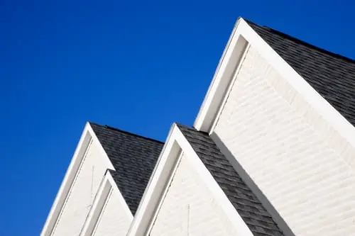 Fresh siding and a new dark shingle roof on a Northwest Arkansas home